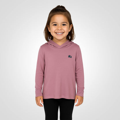 Girl wearing the sun protecting pink bamboo sun shirt and base layer.