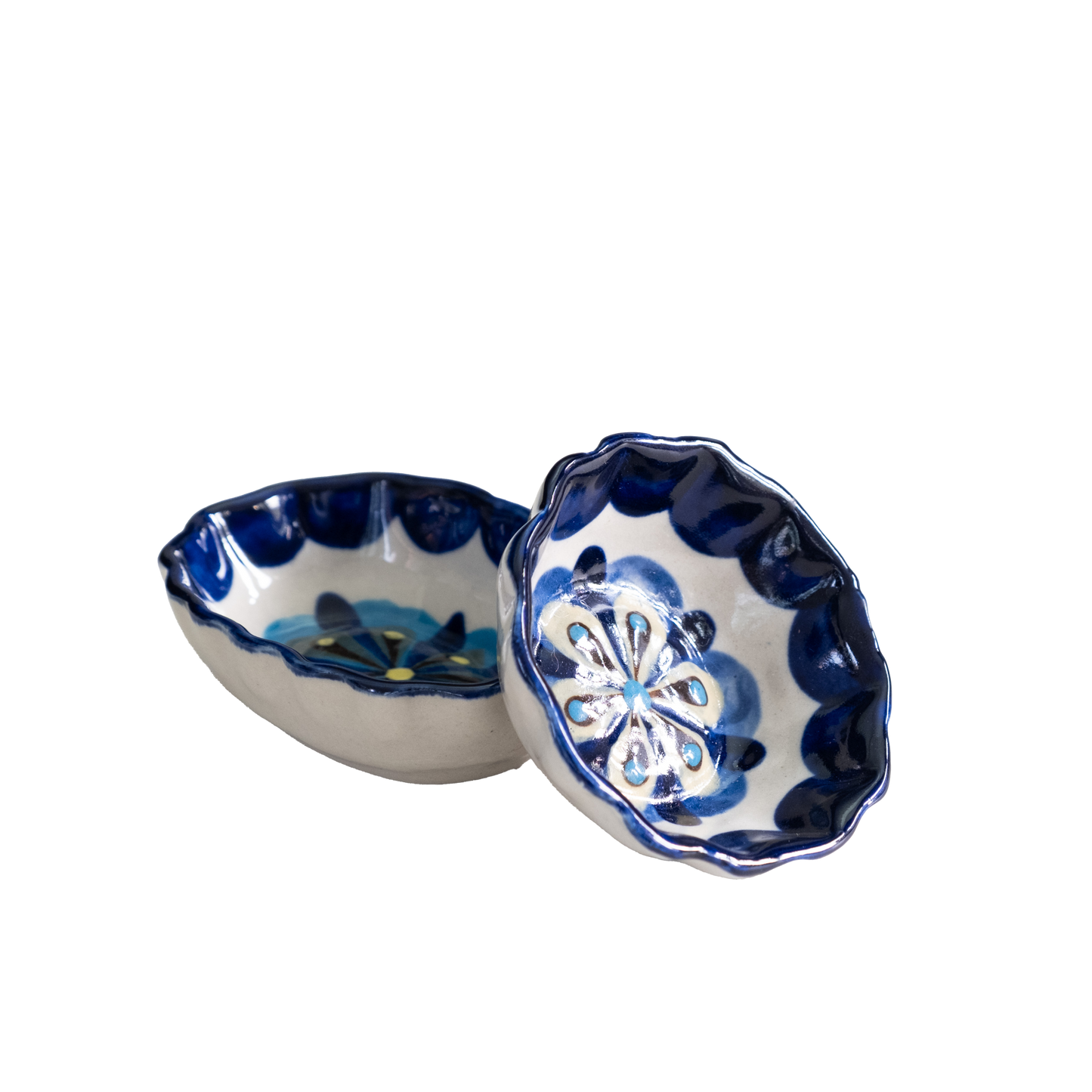 Blue and white painted round and oval tapas bowls.