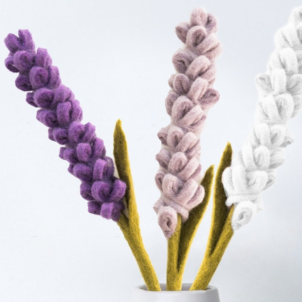 Close up of purple, light purple, and white felt Lavender flowers.