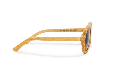 Side view of avion style natural colored bamboo sunglasses with rose gold mirrored lenses.