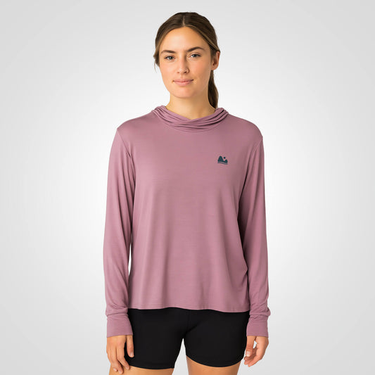 Woman wearing pink bamboo sun shirt UPF ONE shirt and base layer.