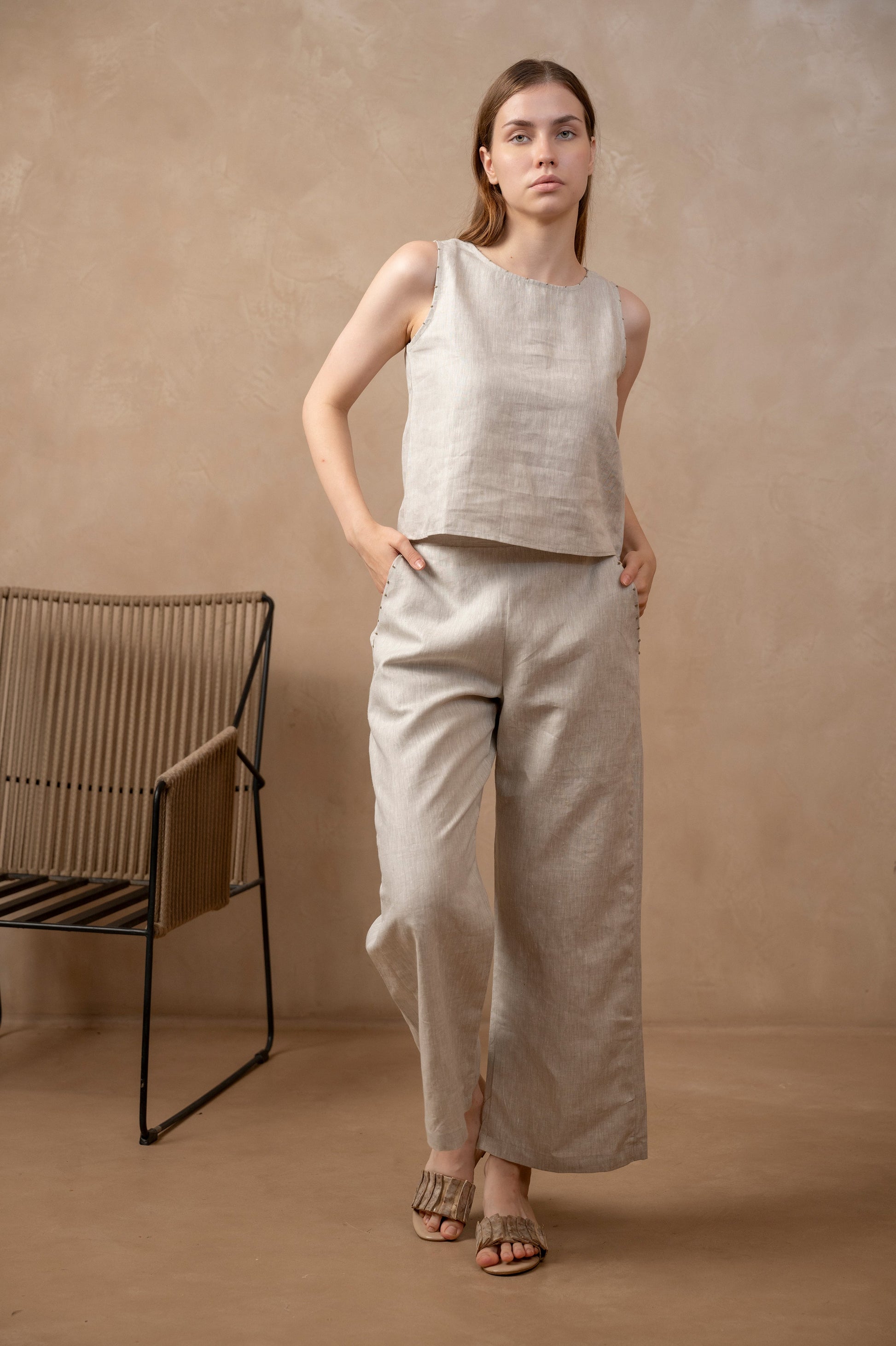 Woman wearing Taru | Wide Leg Ankle Pants and matching neutral top.
