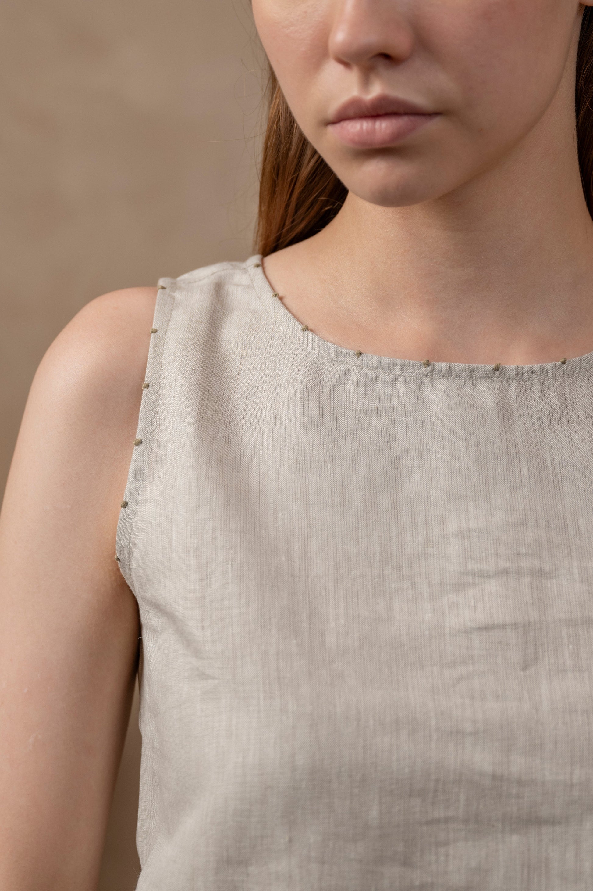 Closeup front view of woman wearing Tulua Women's Sleeveless Top, Natural Hemp Sustainable Fabric,  close up, Details, embroidery, linen