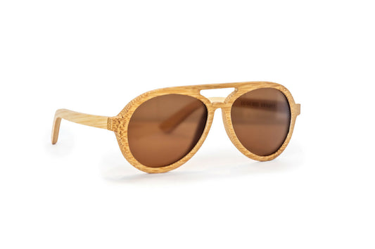 Diagonal view of avion style natural colored bamboo sunglasses with amber lenses.