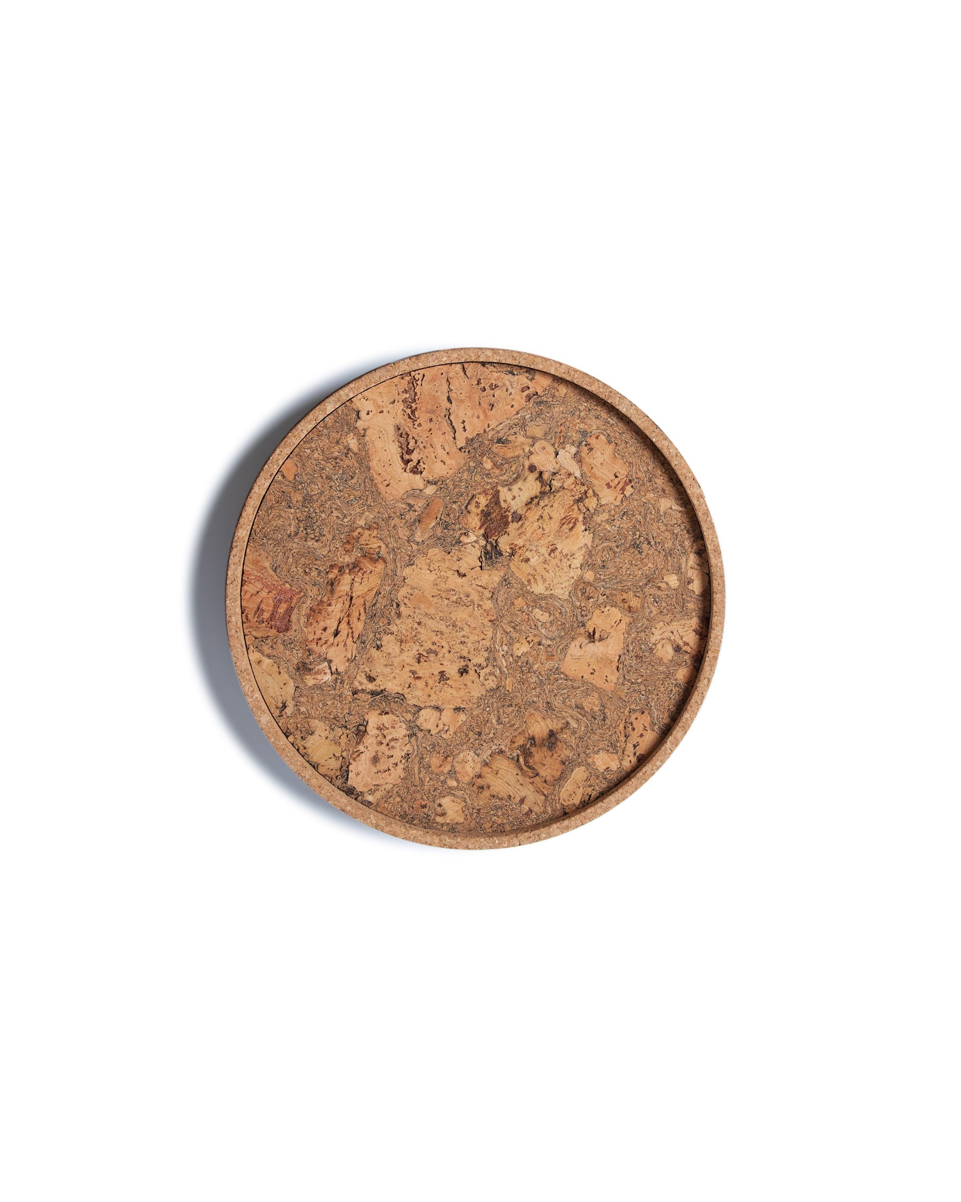 Top view of a circular cork Lazy Susan spinning tray with acacia wood base.