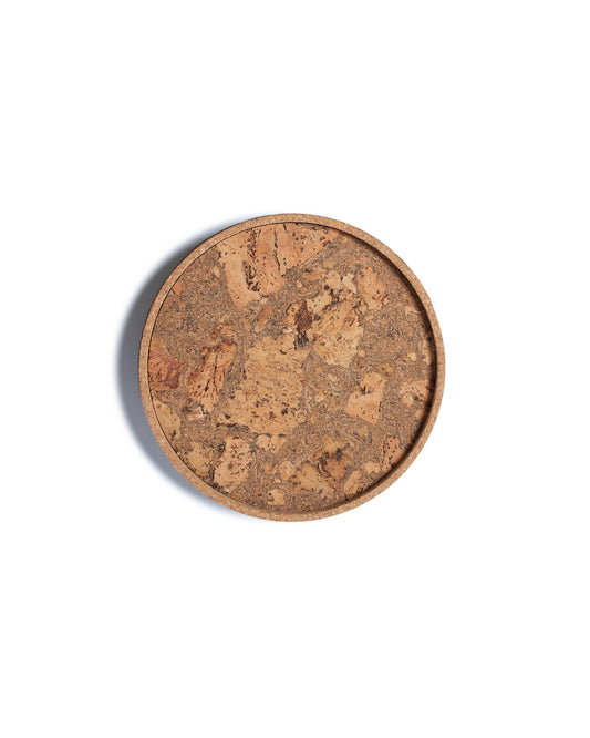 Top view of a circular cork Lazy Susan spinning tray with acacia wood base.