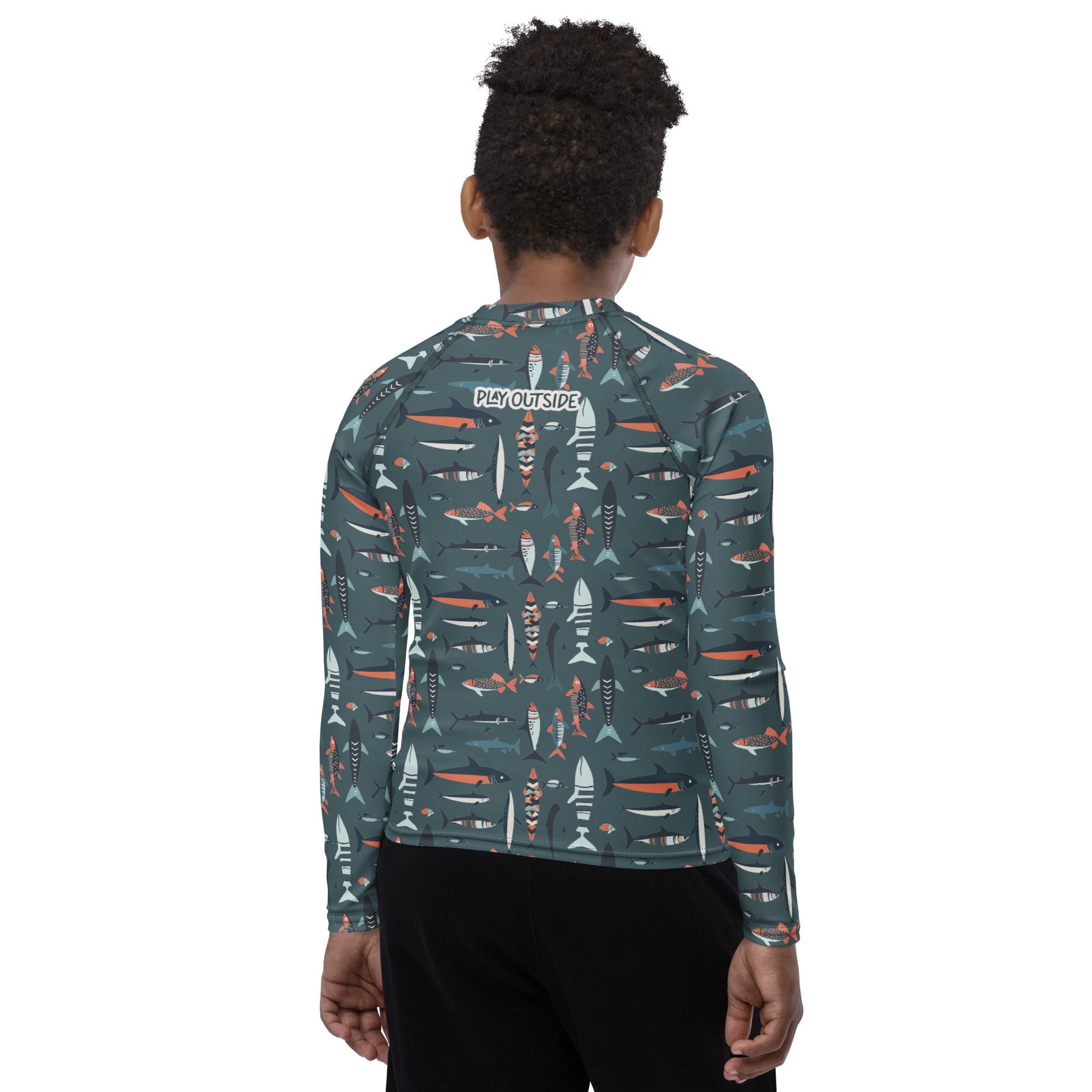 A youth fish rash guard featuring aquatic patterns, made with eco-friendly, odor-resistant fabric for outdoor adventures.