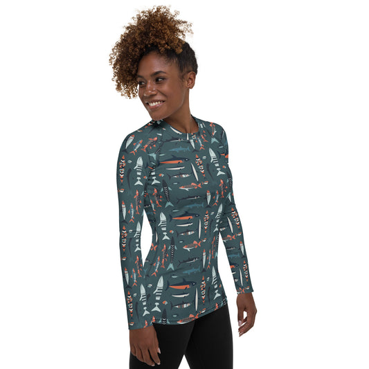 A stylish women’s rash guard with colorful fish patterns, designed for sun protection during hiking, swimming, or boating.