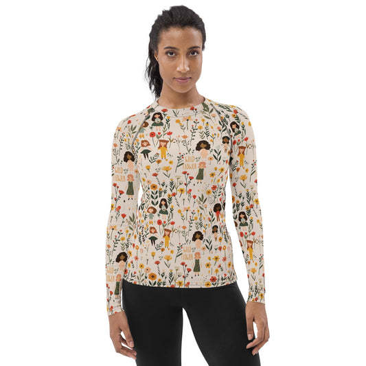 A women’s rash guard with soft floral tones, offering stylish sun protection and comfort for outdoor exploration.