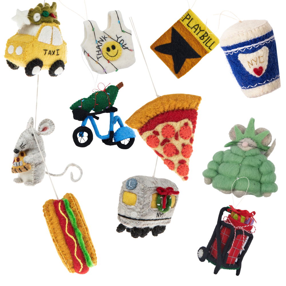 New York City themed felt Christmas ornaments featuring a taxi with Christmas tree, a smiley face thank you bag, a playbill, a to go coffee cup, a mouse with cheese, a Citi Bike with Christmas tree, a slice of pizza, a mouse in a Statue of Liberty puffer jacket, a hot dog, a metro train car, and a red granny cart with presents.