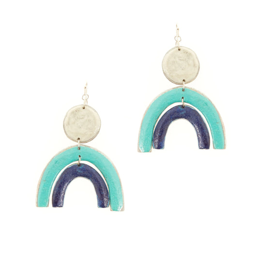 Sterling silver earrings with hanging white circle and a turquoise rainbow arc and dark blue arc below.