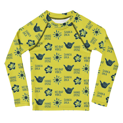 Yellow rashguard with navy designs of the  sun, hibiscus flowers, hang loose hand sign, and the words hang loose, no bad vibes, and shaka laka.