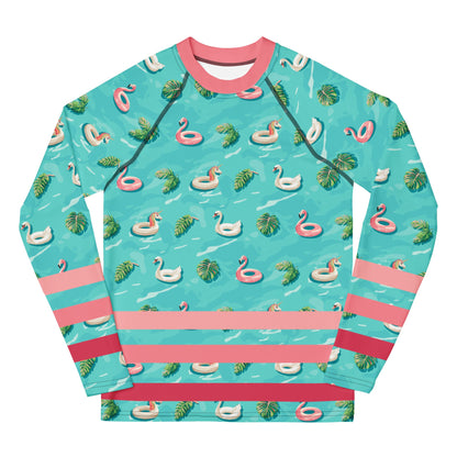 Aqua blue rash guard with pink neckline and pink stripes on the lower half and images of pink floaty toy unicorns, swans, and Flamingos and green tropical leaves.