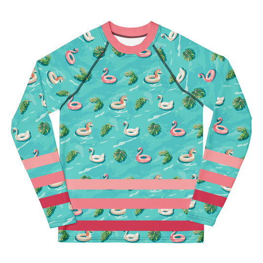 Aqua blue rash guard with pink neckline and pink stripes on the lower half and images of pink floaty toy unicorns, swans, and Flamingos and green tropical leaves.