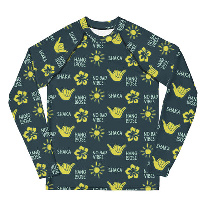 Dark blue rash guard with yellow designs of the sun, hibiscus flowers, hang loose hand sign, and the words hang loose, no bad vibes, and shaka.