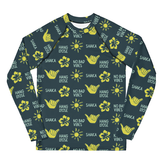 Dark blue rash guard with yellow designs of the sun, hibiscus flowers, hang loose hand sign, and the words hang loose, no bad vibes, and shaka.