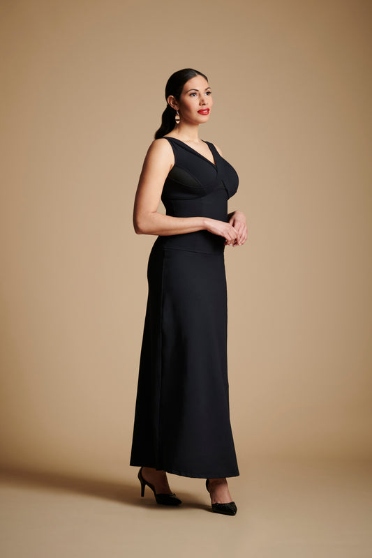 Woman wearing long black dress.