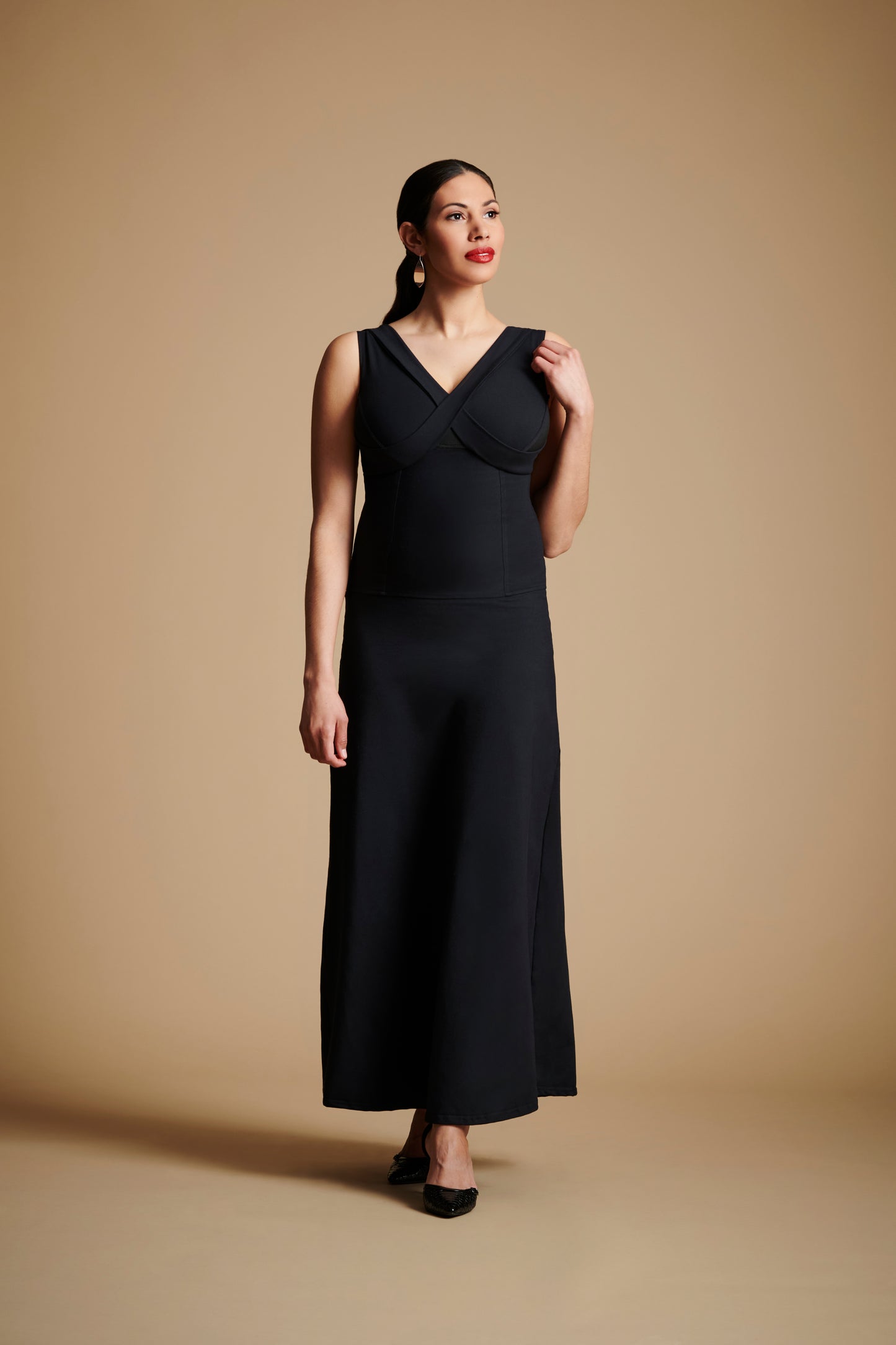 Woman wearing long black dress.