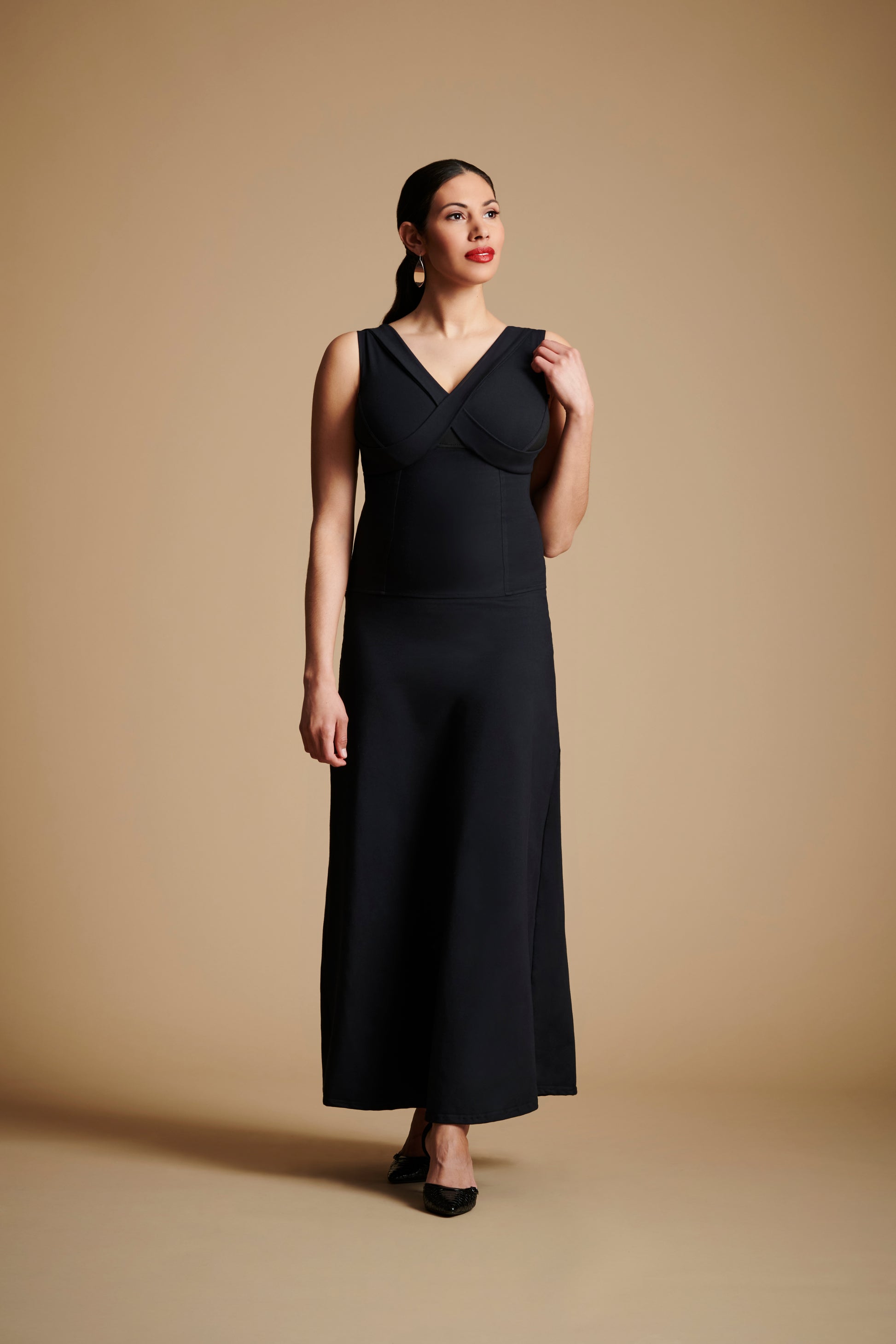 Woman wearing long black dress.