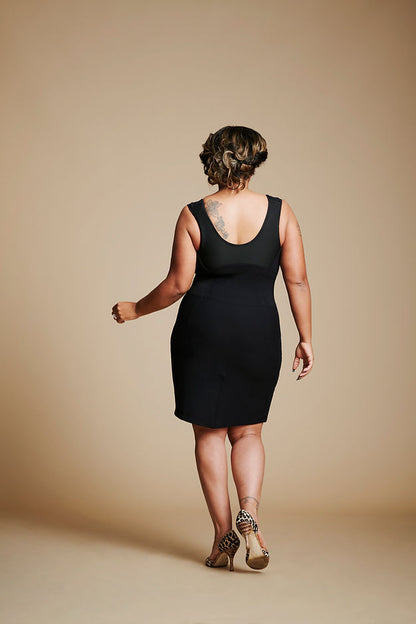 Back view of woman wearing black dress.