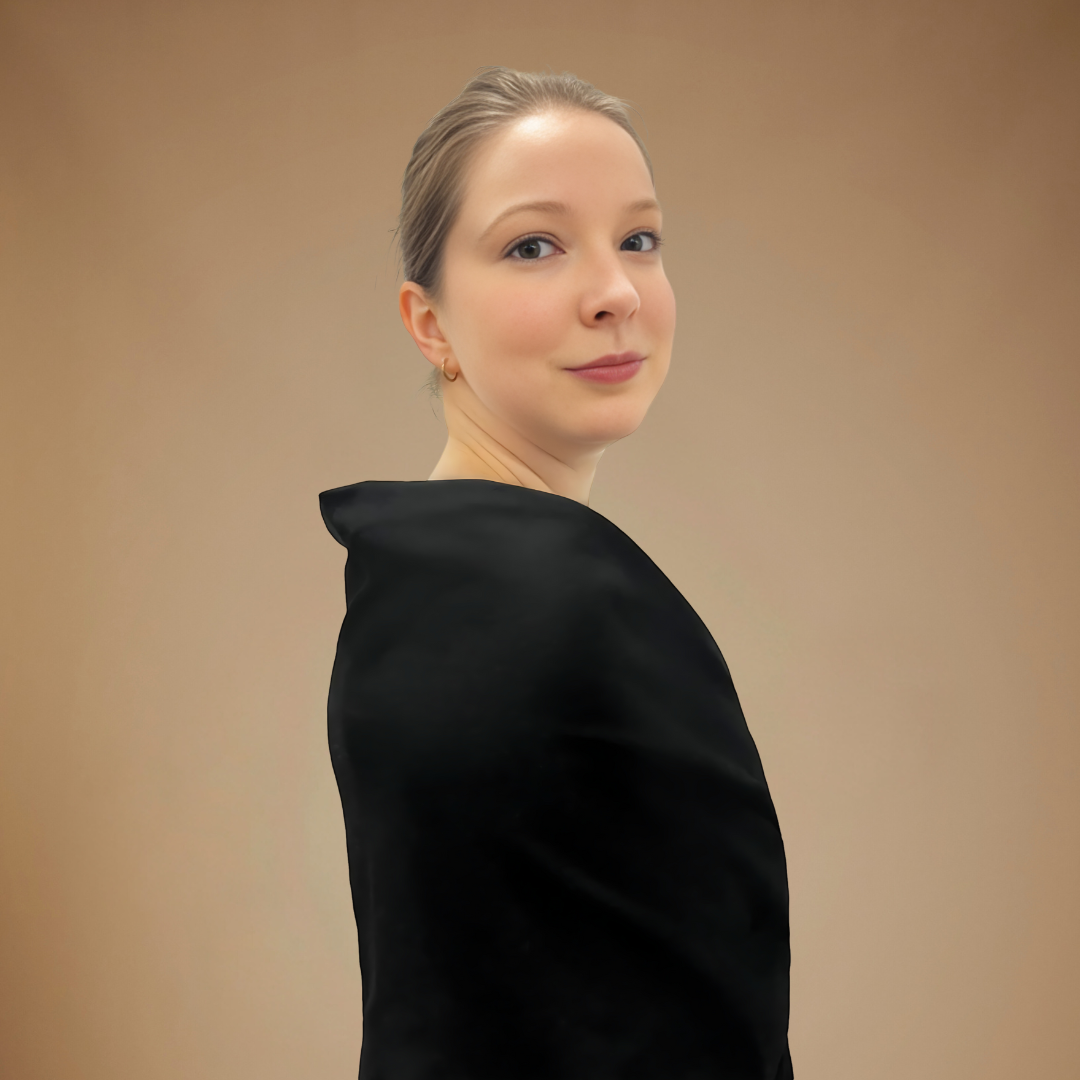 Front right view of woman wearing black wrap.