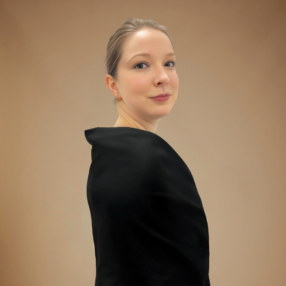 Front right view of woman wearing black wrap.