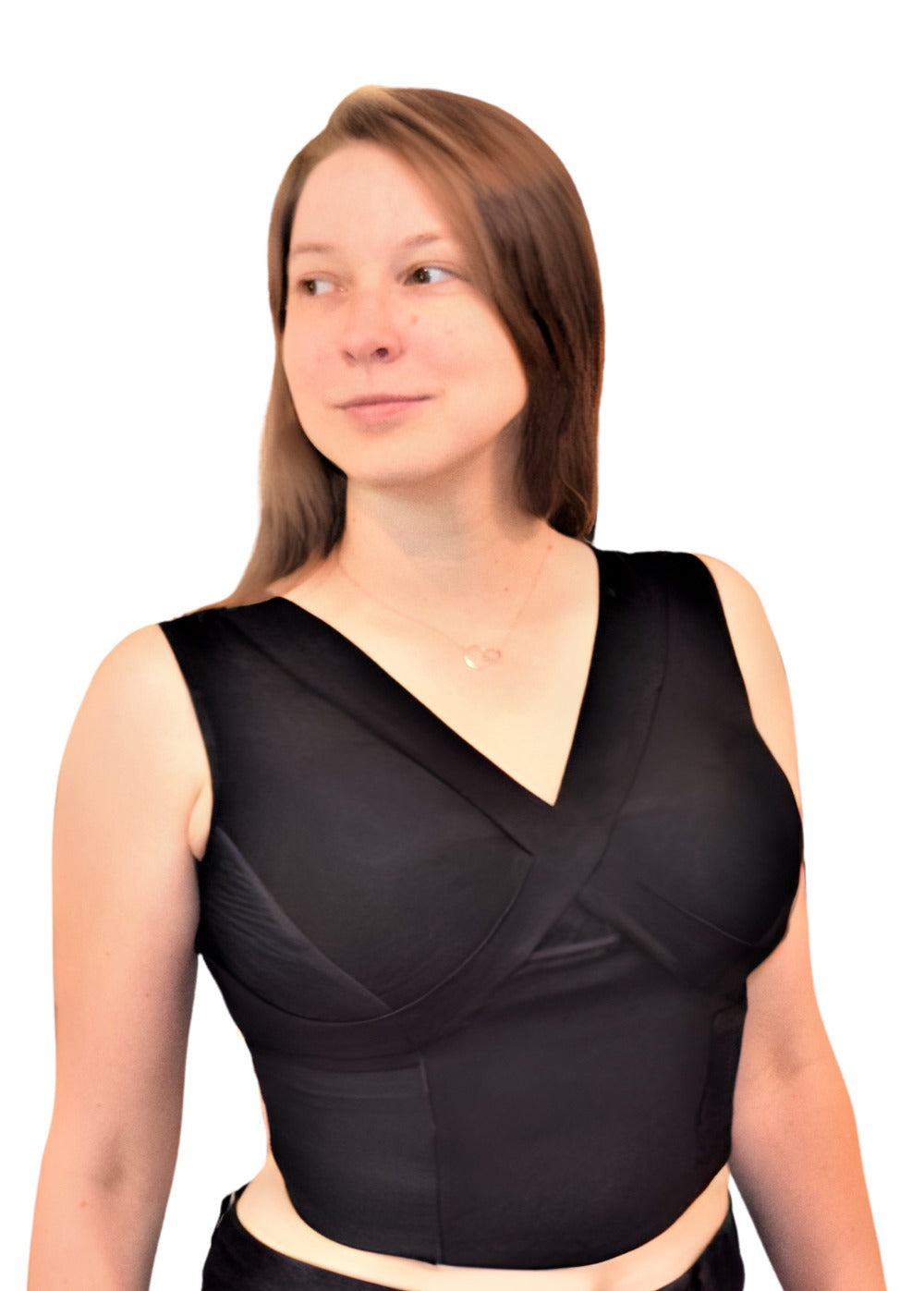 Woman wearing black waist length crop top and black exercise pants.