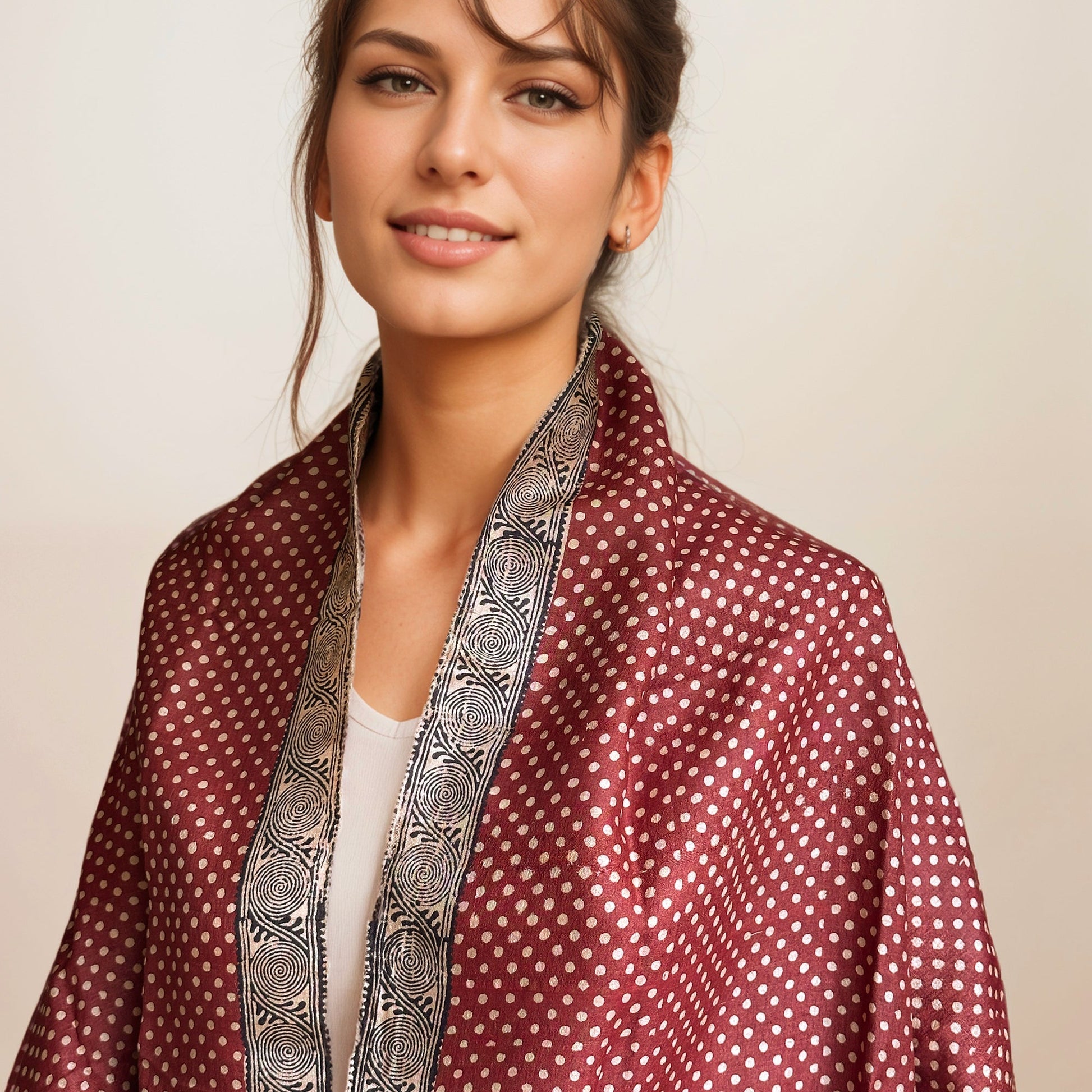 Woman wearing red, black, and natural scarf with natural polka dots.