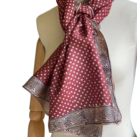 Manikin with red, natural, black stole. Natural polka dots on red background.