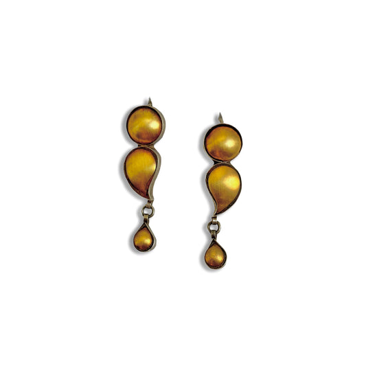 Pair of gold foil earrings with tribal design.