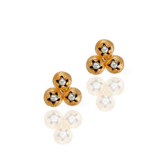 Pair of gold earrings each with three small seed round discs with glass pearl in each center.
