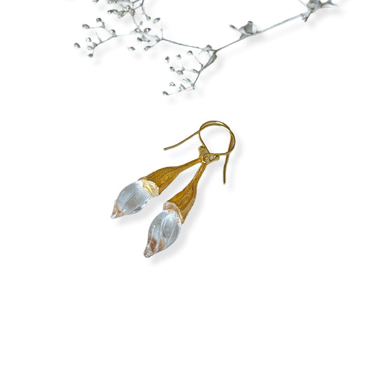 Pair of clear twisted glass bud earrings with gold findings.