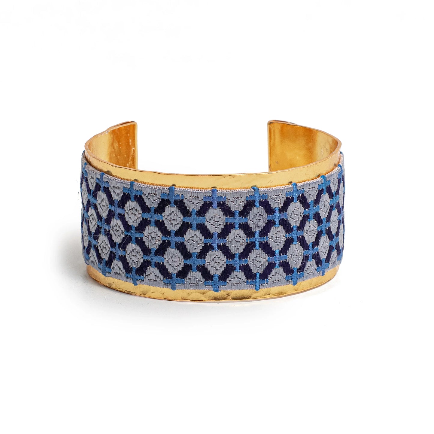 Gold plated cuff bracelet with blue embroidery artisan design.