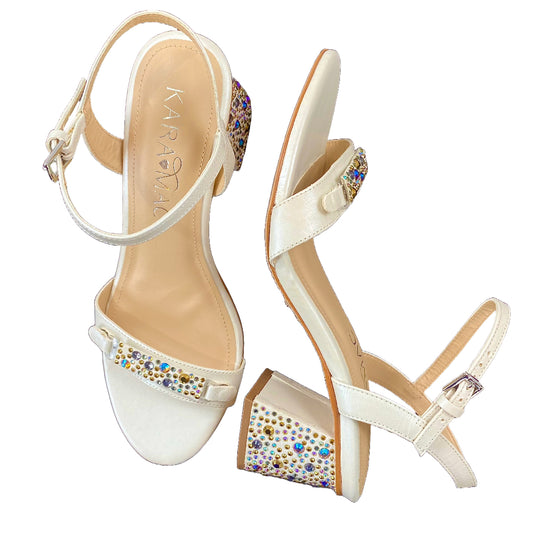 Front and side view of pearl sandal with multi colored toe strap and heel cover.