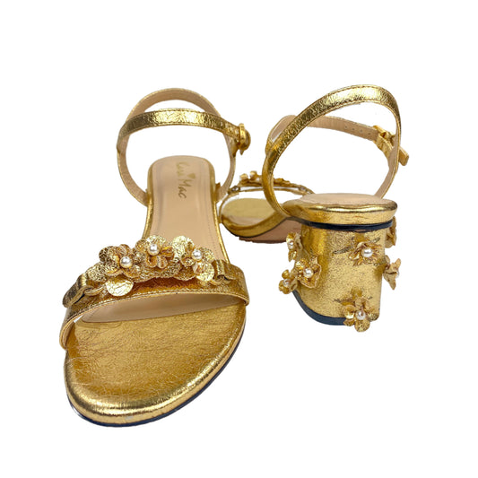 Front and back view of gold sandal with gold colored toe strap and gold heel cover.