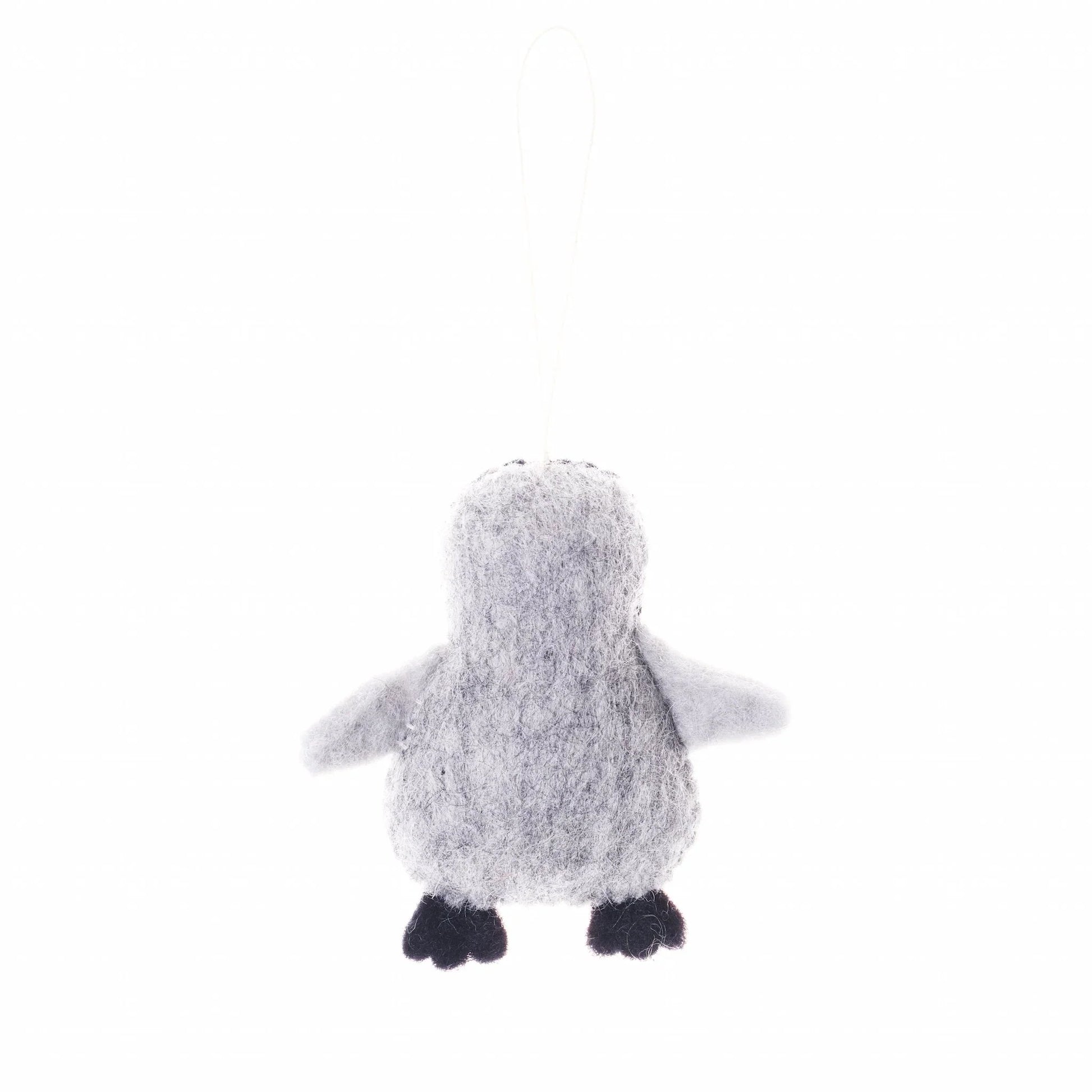 Back view of a felted wool ornament of a grey and black penguin.