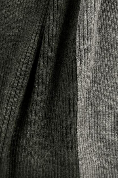 Close up of modern rib Merino wool striped scarf in moss and grey colors.