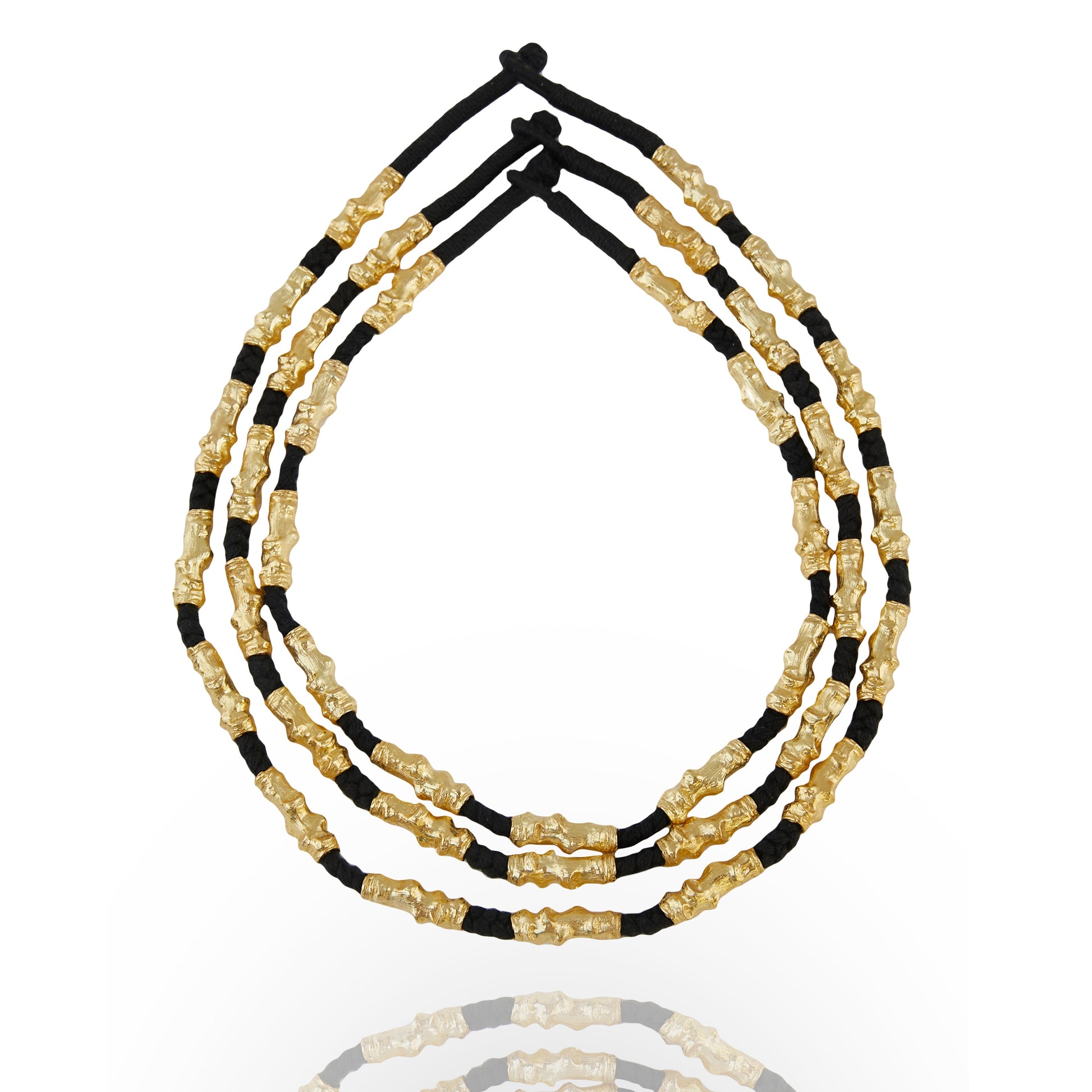 stacked gold plated and black thread necklace