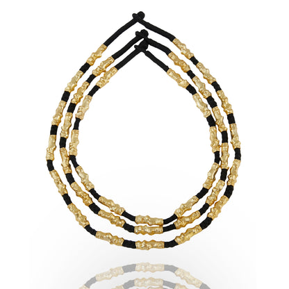 stacked gold plated and black thread necklace