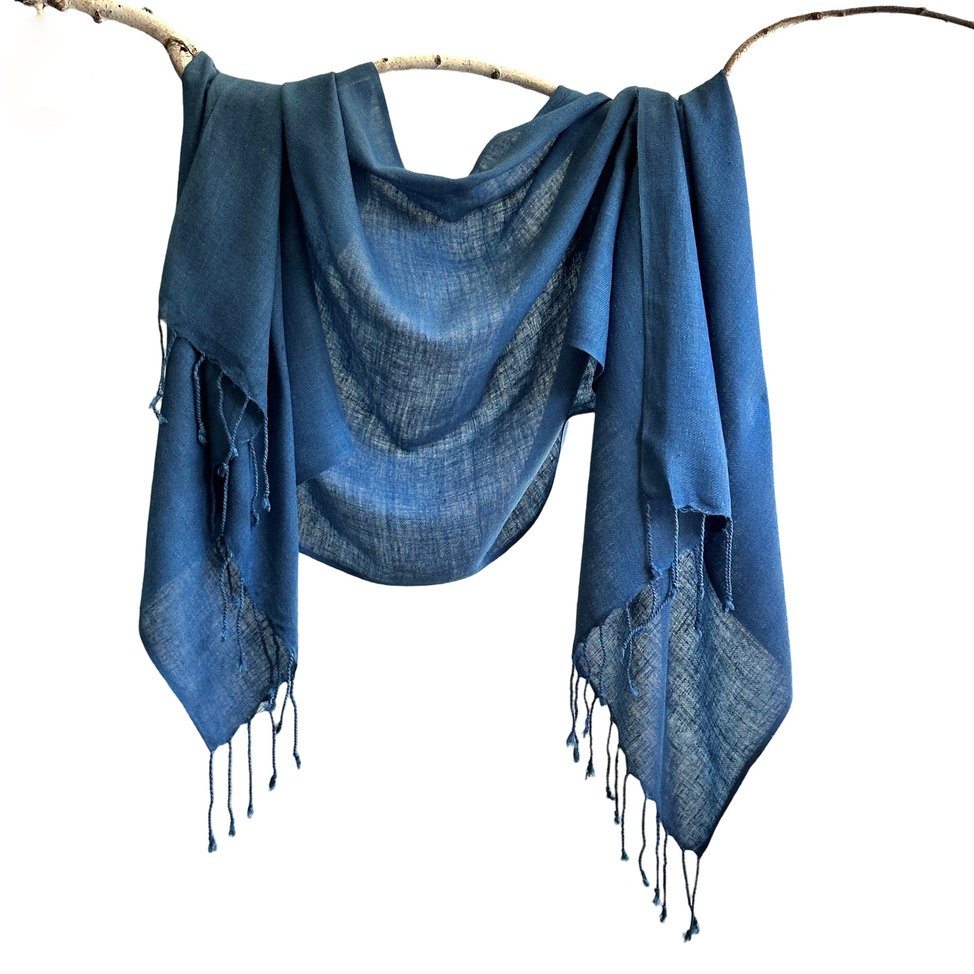 Blue scarf draped over branch.