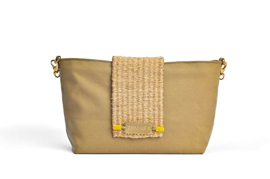 Front view of sandstone green bag with brass details.