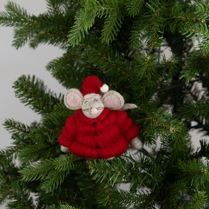 Felt ornament of a mouse in red puffer jacket and Santa hat on a Christmas tree.