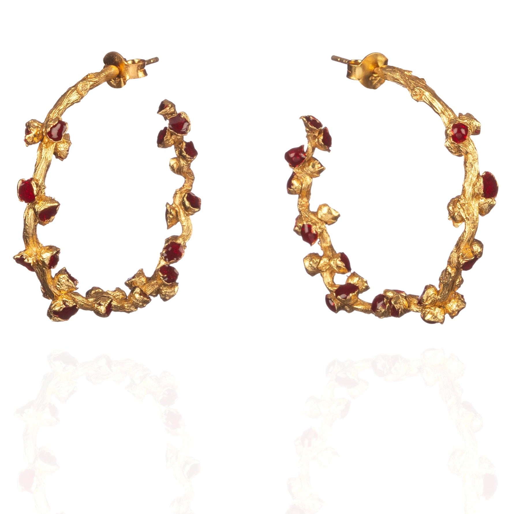 Pair of red and gold hoop earrings.