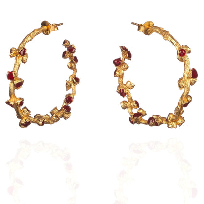Pair of red and gold hoop earrings.