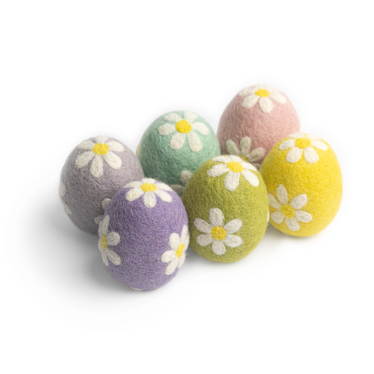 Set of six felt easter eggs in pastel purple, blue, green, pink, and yellow colors decorated with white daisies.
