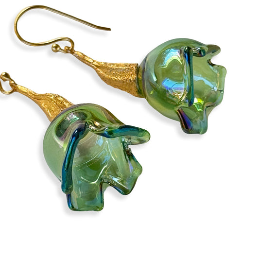 Pair of green pod glass earrings with gold findings.