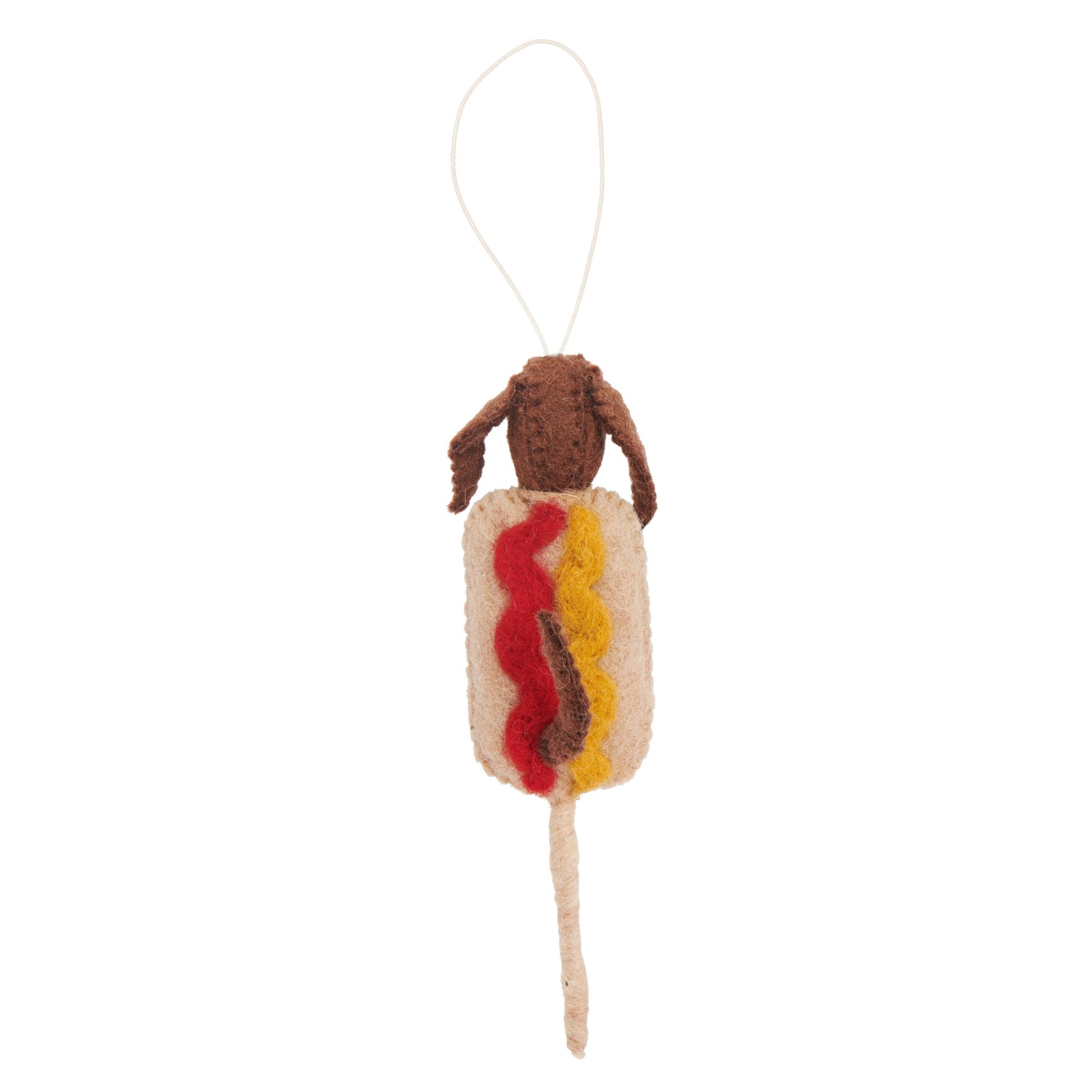 Felt ornament of a brown dog in a brown corn dog on a stick with ketchup and mustard.