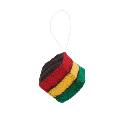 Felt ornament of Italian Rainbow cookie square with green at the bottom, yellow in the middle, red above the yellow and brown chocolate on top.