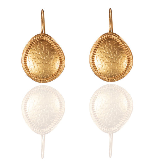 gold plated brass earrings with reflection below.