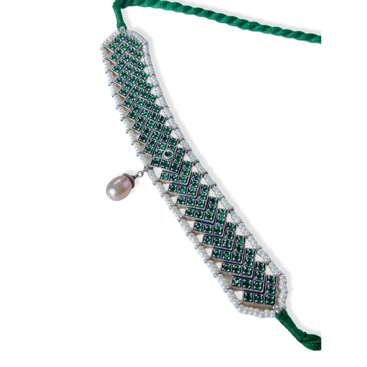 Green and silver choker necklace surrounded by white beads, with a drop pearl at the center.
